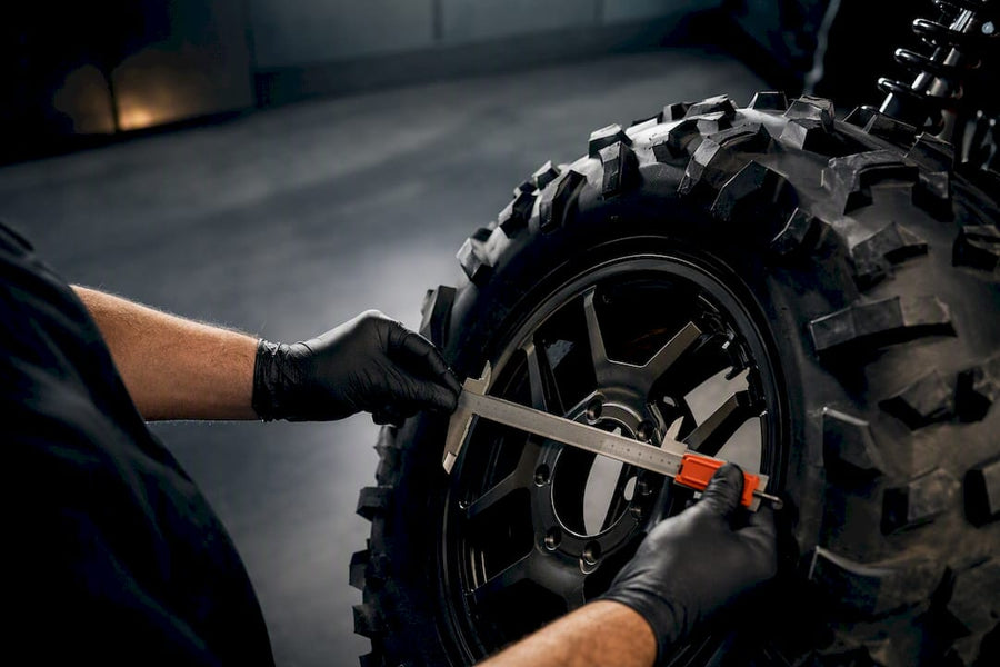 Technician measuring an off-road tire rim