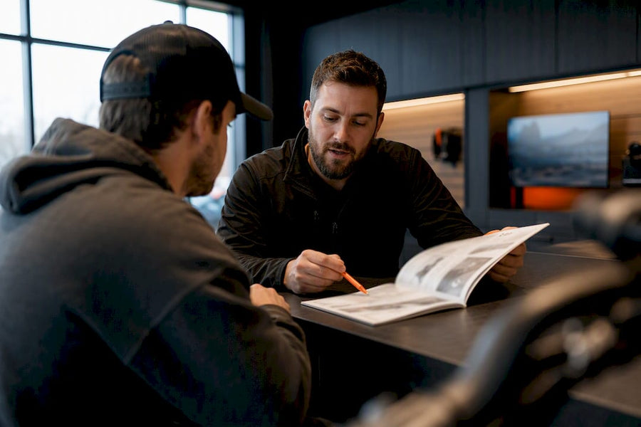 Dealer and customer reviewing warranty terms