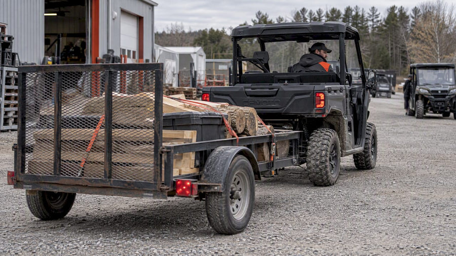 CFMOTO UFORCE towing loaded utility trailer